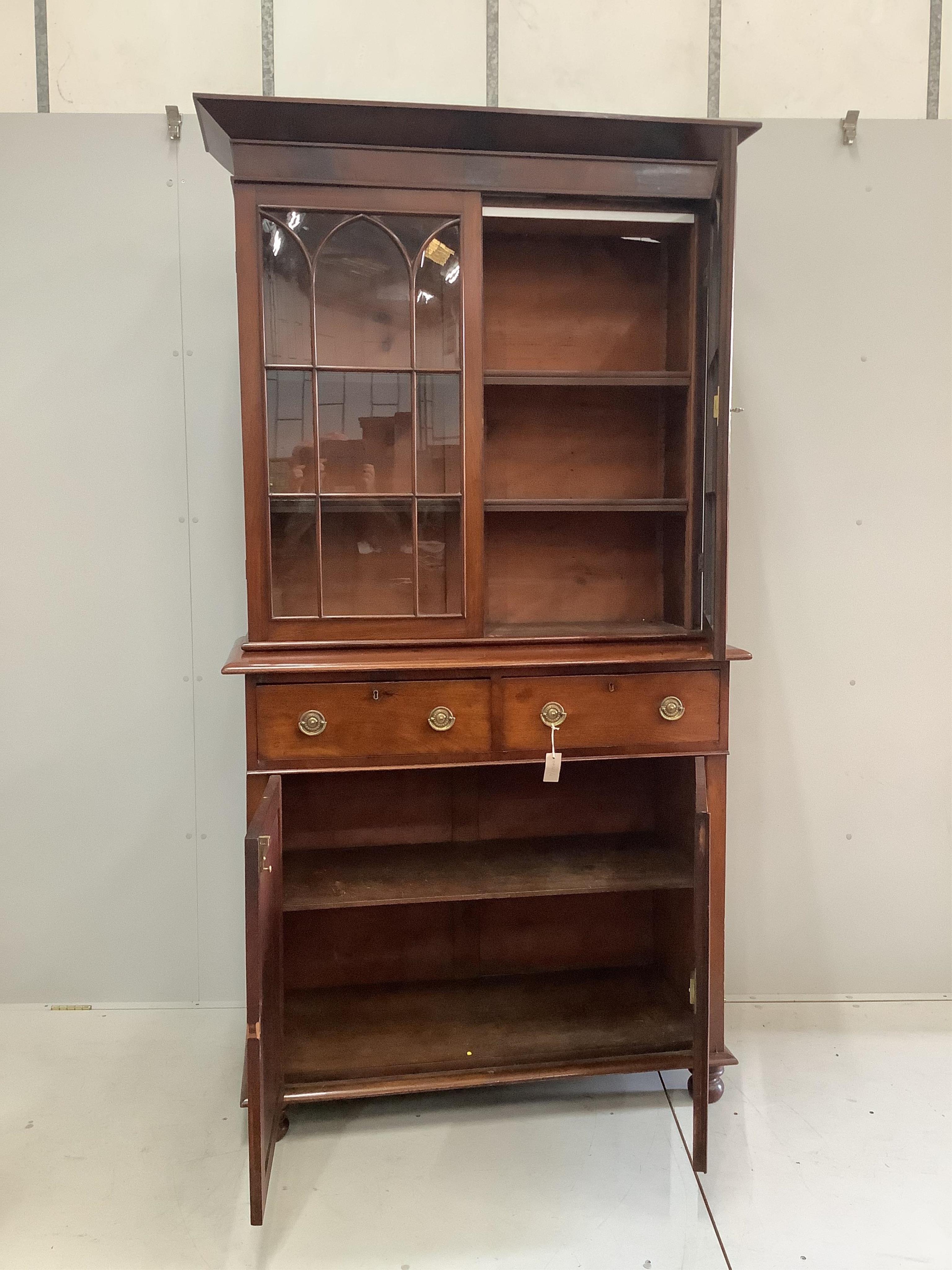 A George III and later mahogany bookcase cupboard, width 115cm, depth 49cm, height 221cm. Condition - good